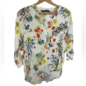 Zara floral blouse in light colors, 3/4 length sleeves in a crinkly material.